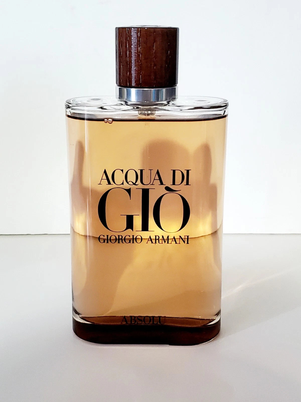 Perfume bottle labeled 'Acqua di Giò' by Giorgio Armani on a white background