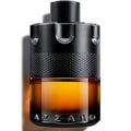 Azzaro perfume bottle with black cap and brown body on a white background