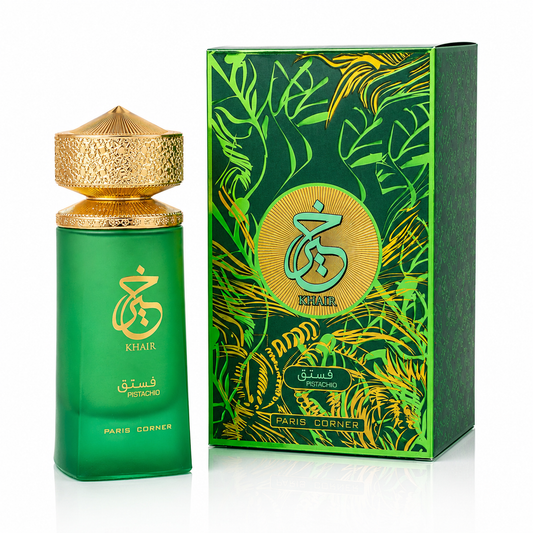 Green perfume bottle with gold cap and matching box featuring intricate designs on a white background