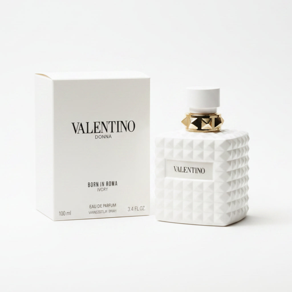 Valentino perfume bottle and packaging on a marble surface with a dark background