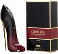 Black high-heeled shoe and Carolina Herrera 'Good Girl' perfume box on a white background
